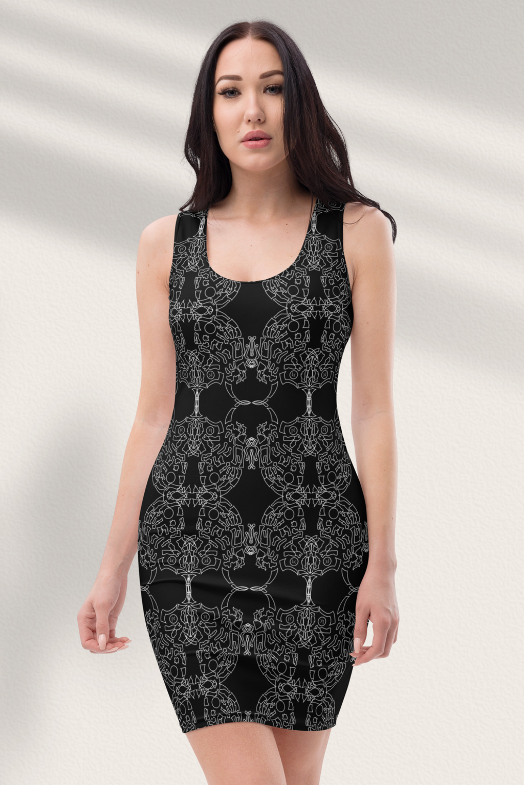 A woman wearing a black, floral print mini evening cocktail dress with three-quarter sleeves.