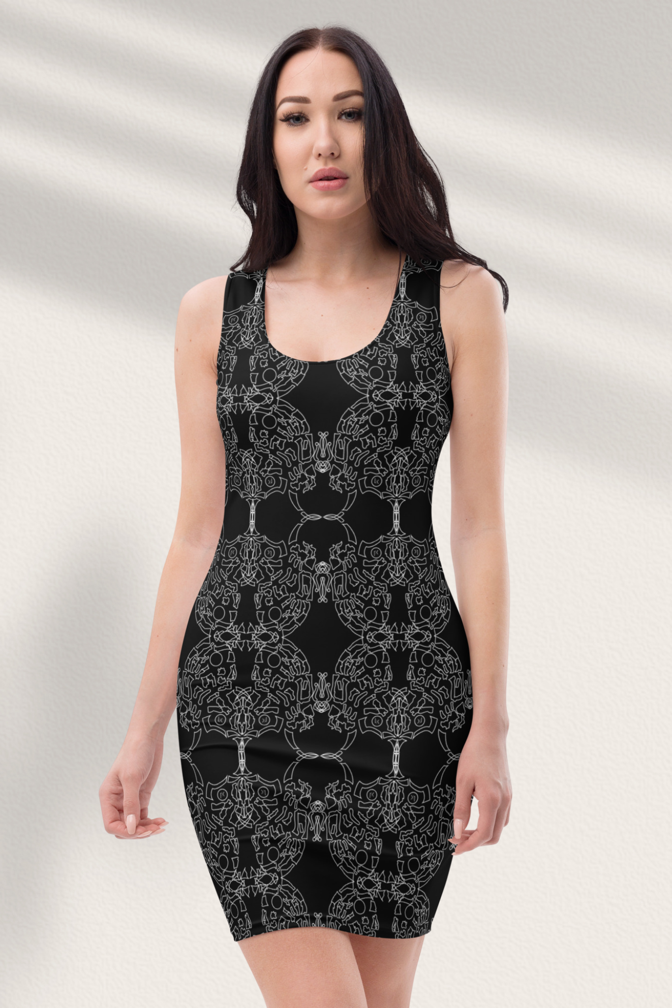 A woman wearing a black, floral print mini evening cocktail dress with three-quarter sleeves.