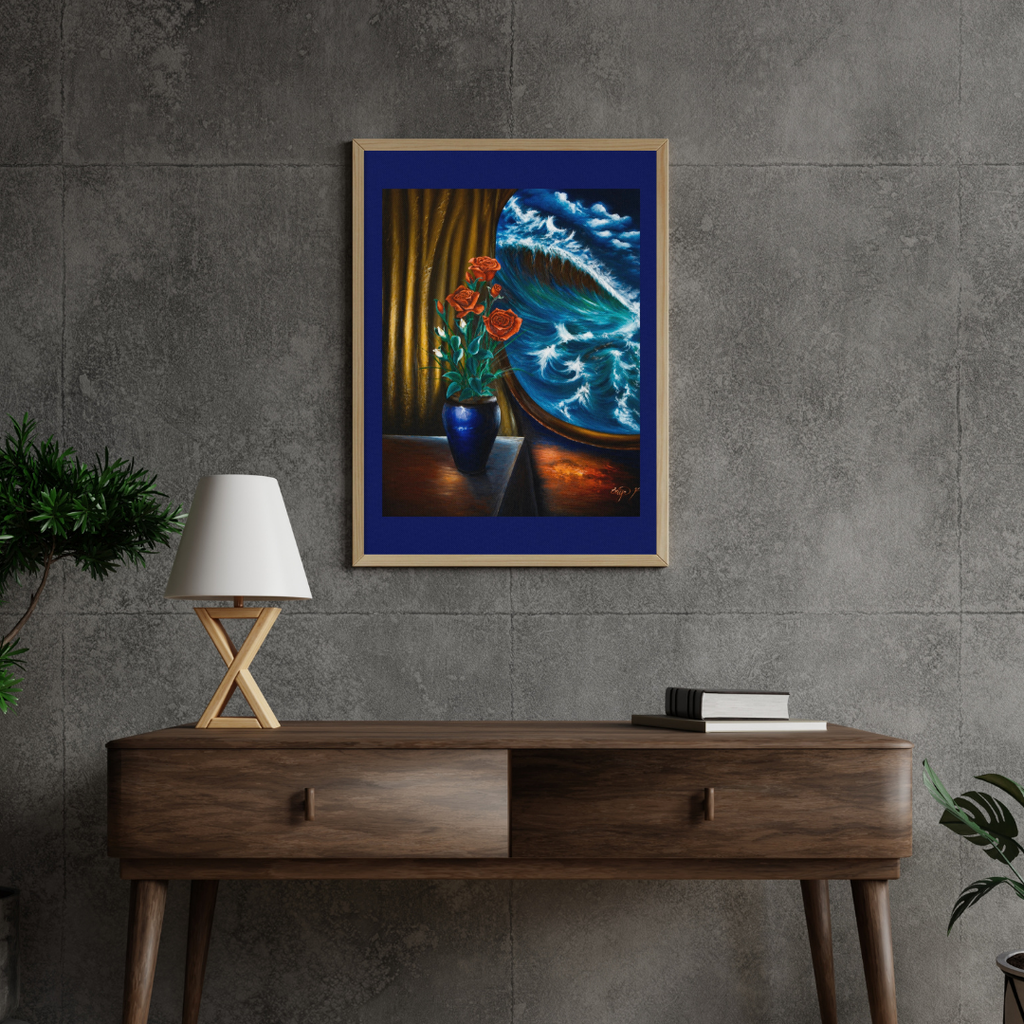 A framed art print depicting a dramatic blue ocean wave crashing against a window, with red poppies in a blue vase and gold curtains, displayed on a gray concrete wall above a wooden console table with a lamp and books.