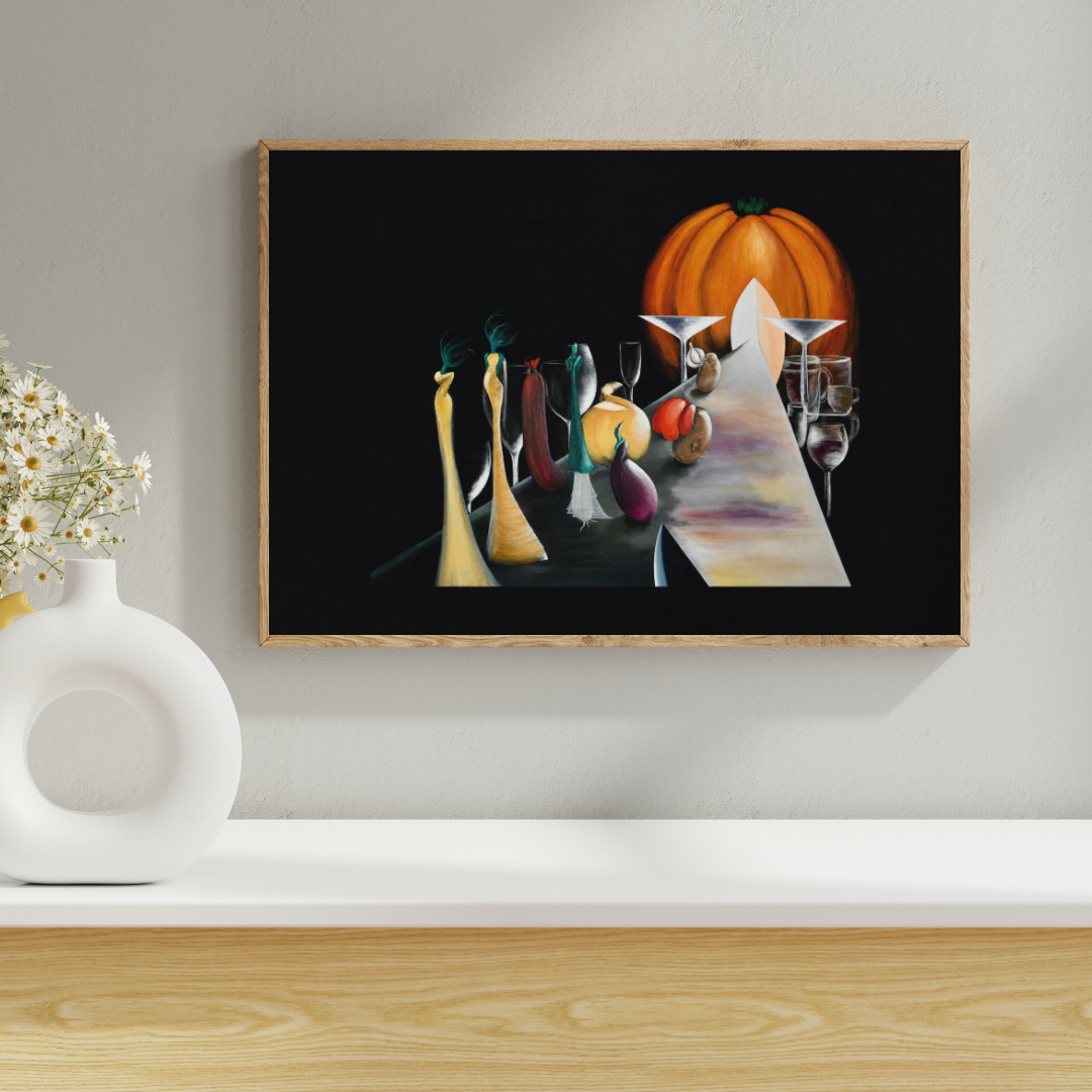 A framed still life art print depicting a table setting with a large orange pumpkin, tall yellow and green bottles, and wine glasses on a black background, displayed on a shelf next to a white vase with flowers.