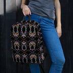 High-definition print detail of orange and blue abstract swirls on a bag.