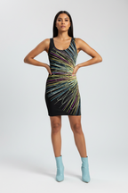 Woman wearing a black dress with colorful abstract pattern on a white background