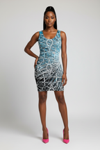 Woman wearing a blue and white patterned dress on a plain background