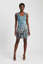 Woman wearing a blue patterned dress on a white background