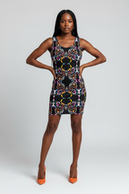Woman wearing a patterned dress on a white background