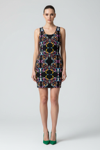 Woman wearing a colorful patterned dress on a white background
