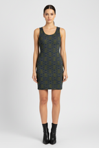 Woman wearing a patterned dress on a white background