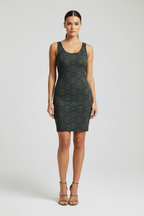 Woman wearing a patterned dress on a white background