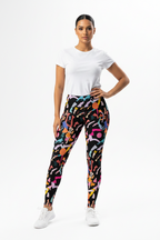 Woman wearing a white t-shirt and colorful patterned leggings on a white background