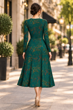 Teal green art-print fashion dress showcasing expressive hand-drawn details