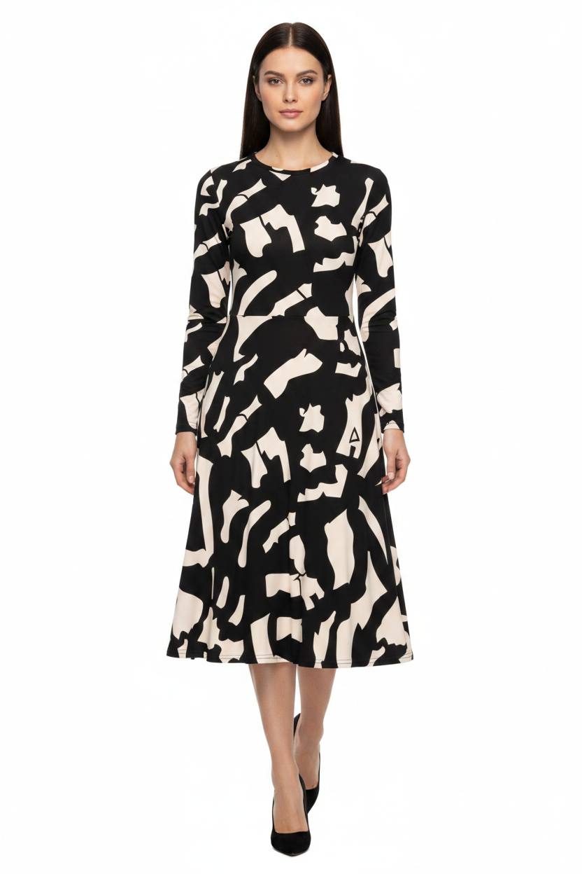 Woman wearing a black and white patterned dress on a white background