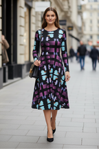 Woman in a patterned dress walking on a city street