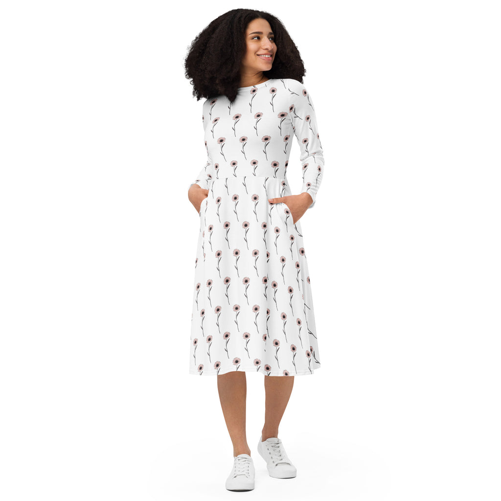 Woman wearing a white dress with a red pattern on a white background