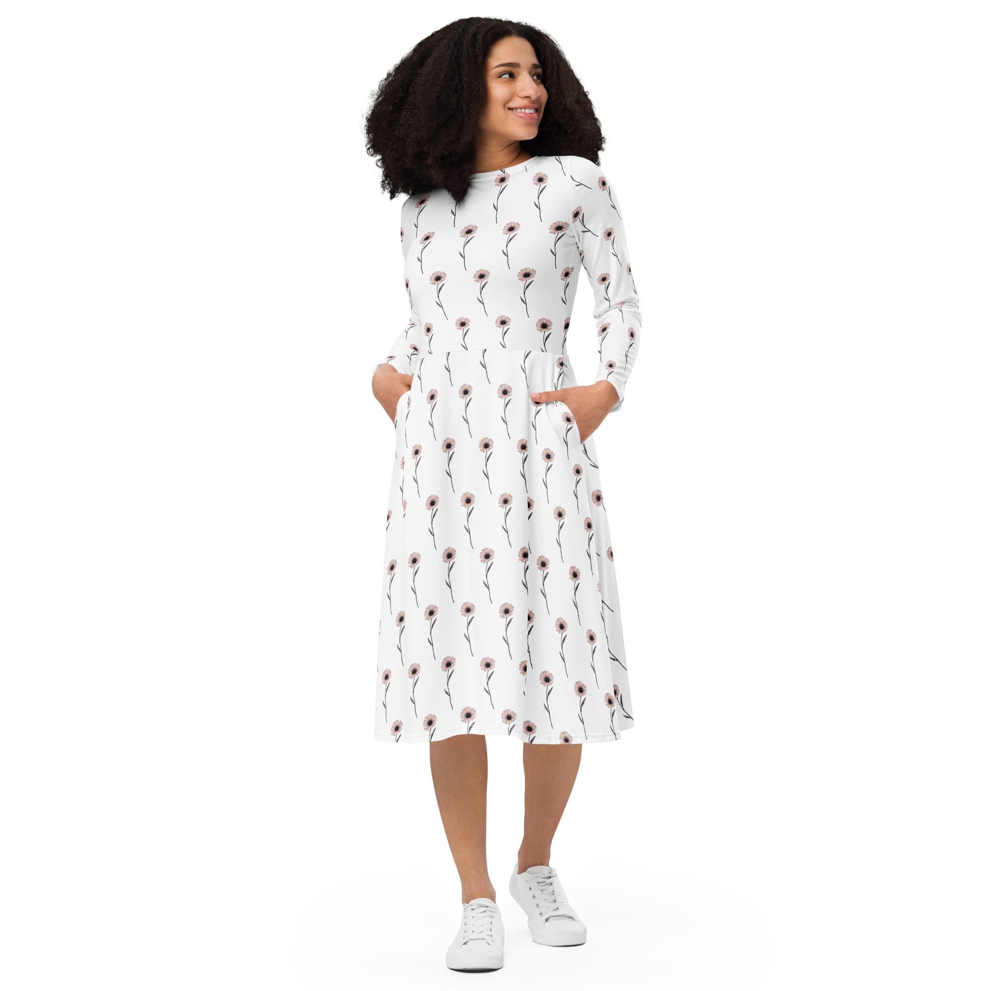 Woman wearing a white dress with a red pattern on a white background