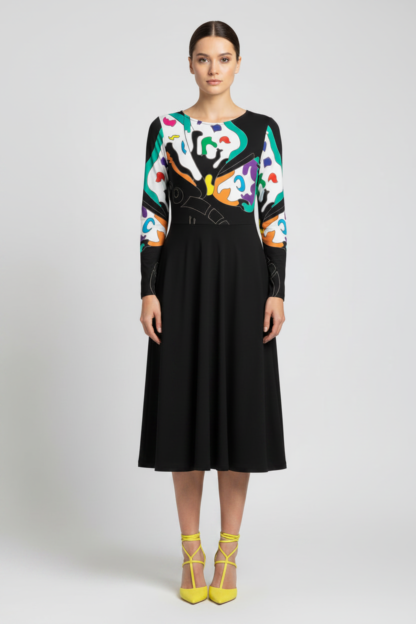 Woman wearing a black dress with a colorful abstract pattern on a white background