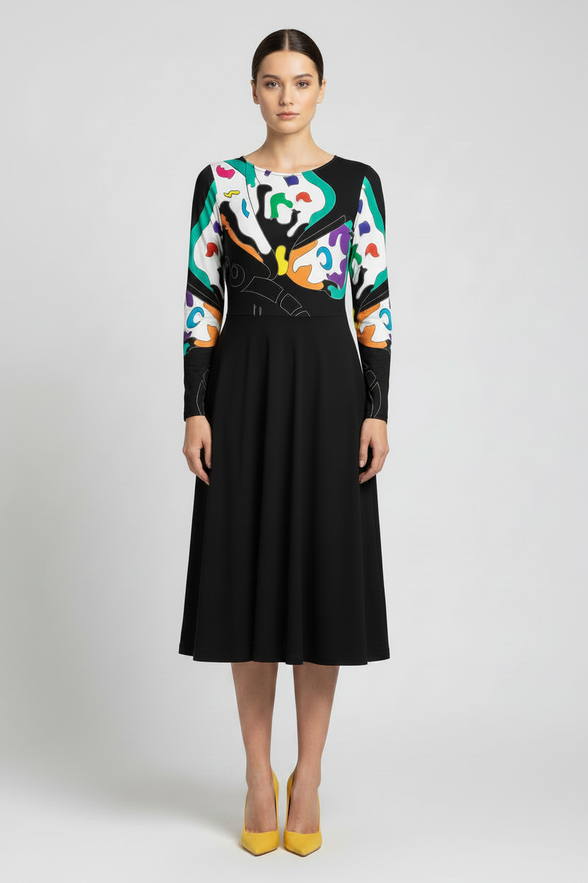 Woman wearing a black dress with colorful abstract patterns on a white background