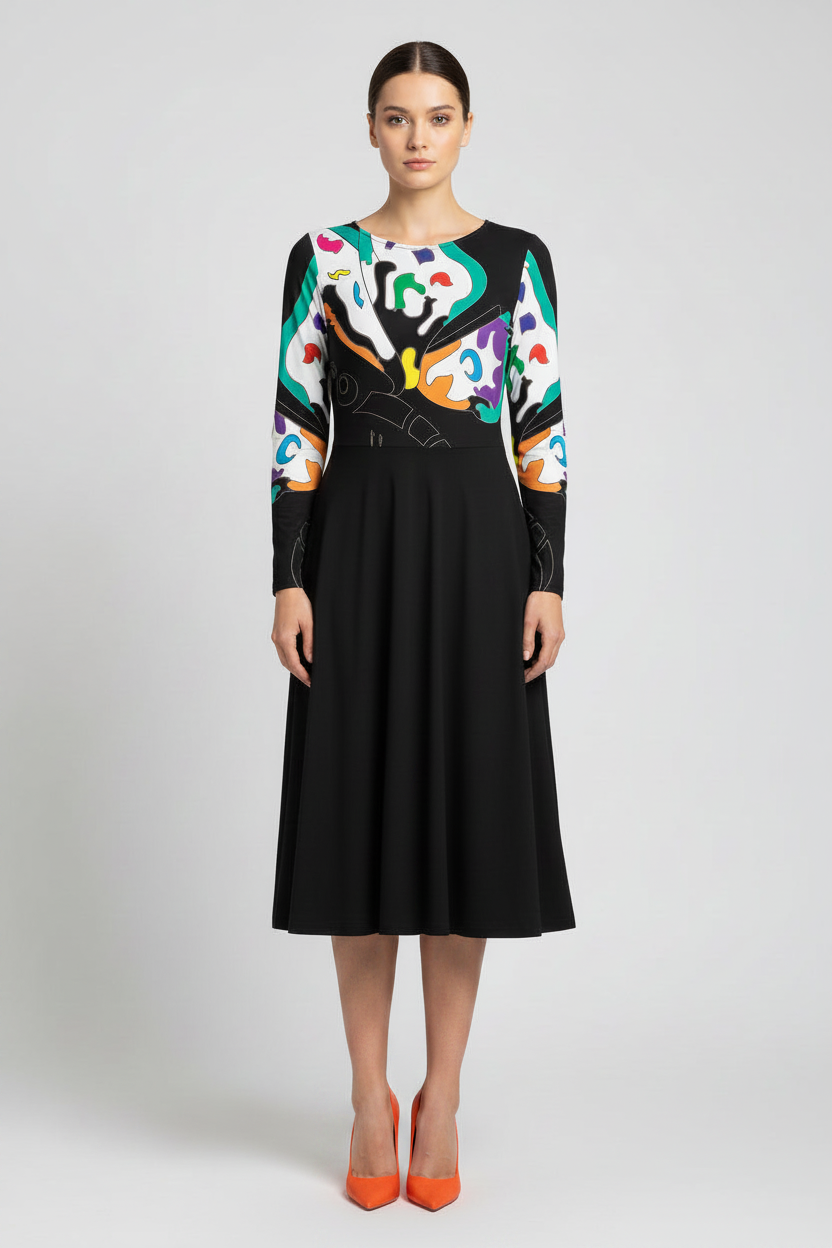 Woman wearing a black dress with colorful abstract pattern on a white background