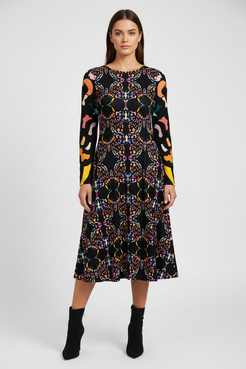 Woman wearing a patterned dress on a white background