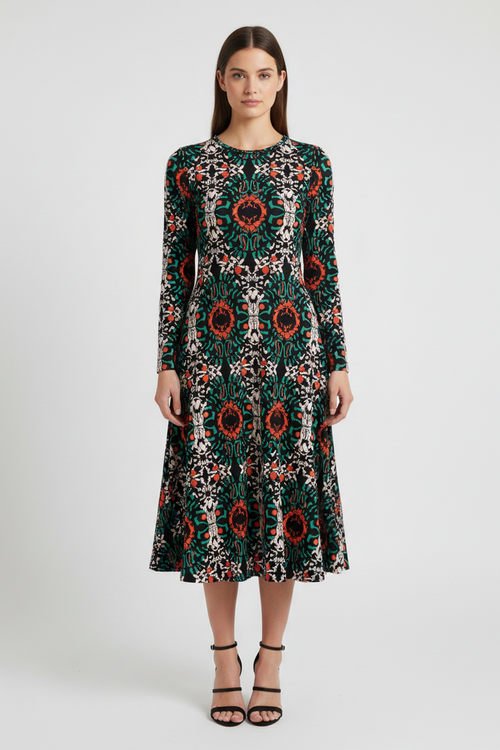 Woman wearing a patterned dress on a white background
