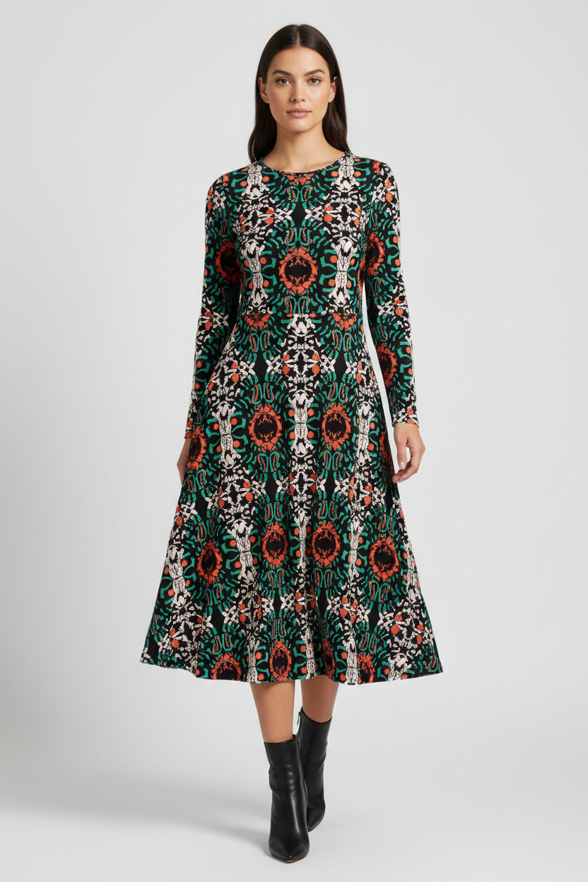 Woman wearing a patterned dress on a white background