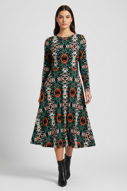 Woman wearing a patterned dress on a white background