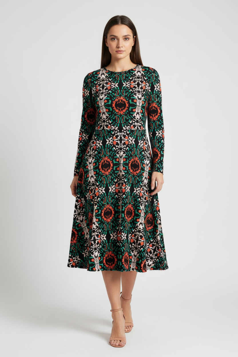 Woman wearing a patterned dress on a white background