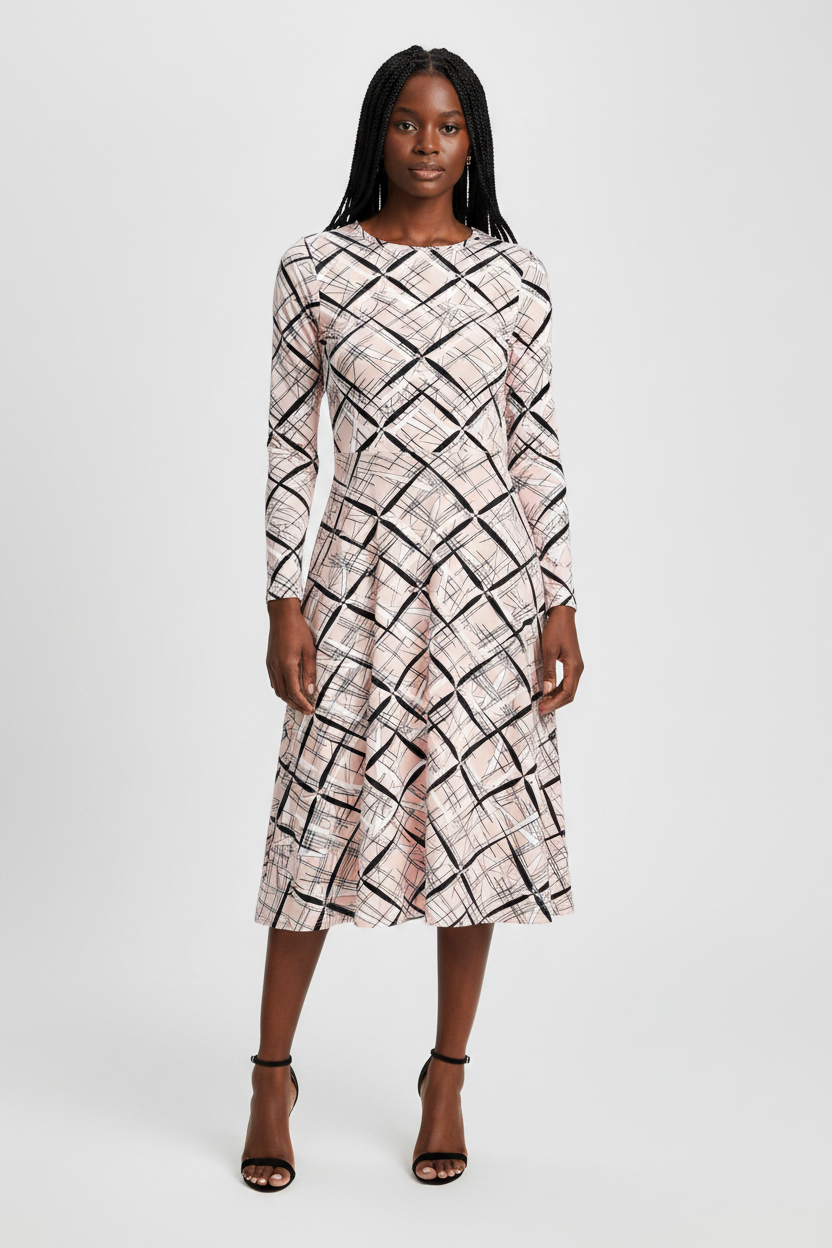 Woman wearing a patterned dress on a white background