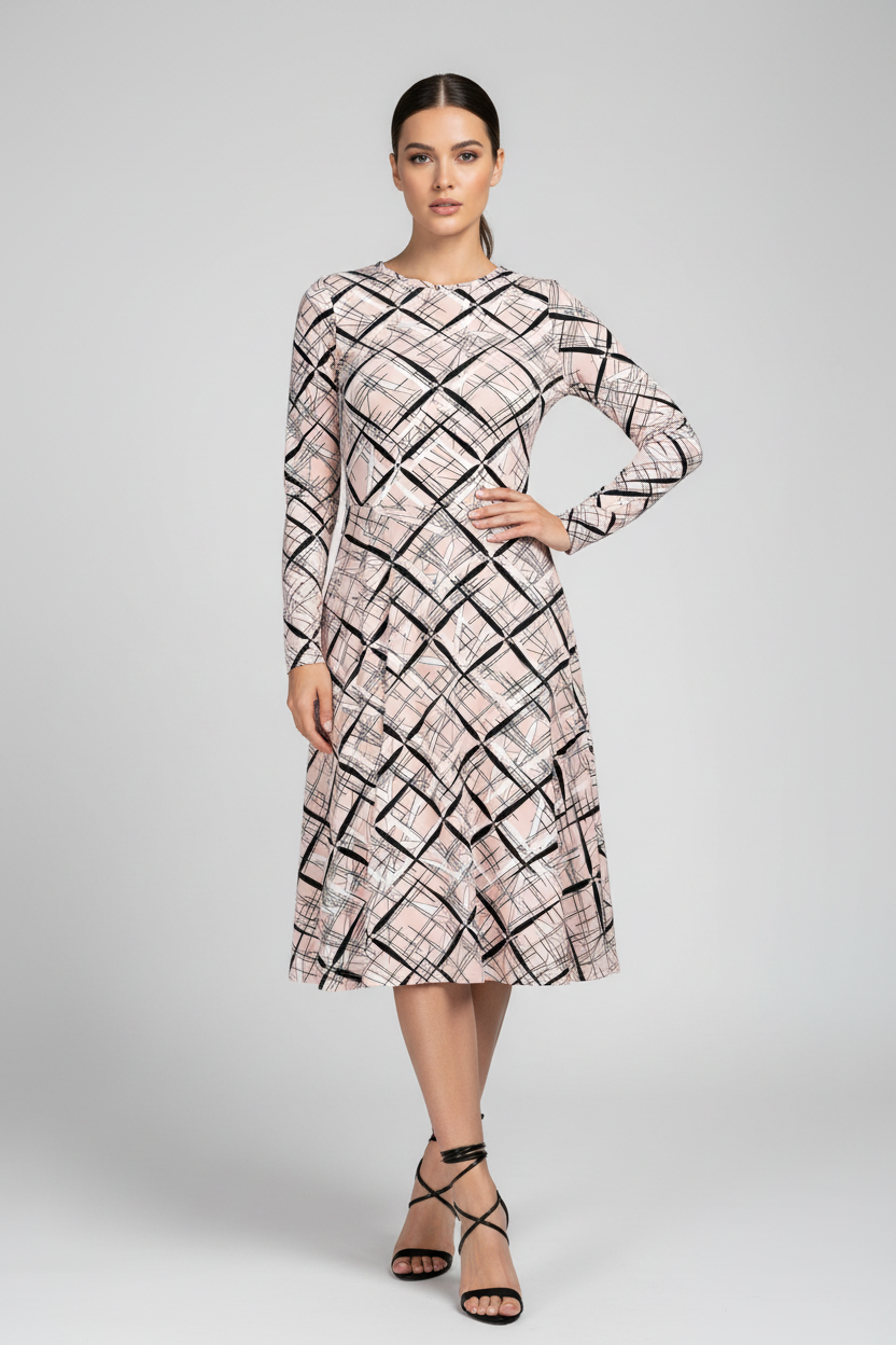 Woman wearing a patterned dress on a gray background