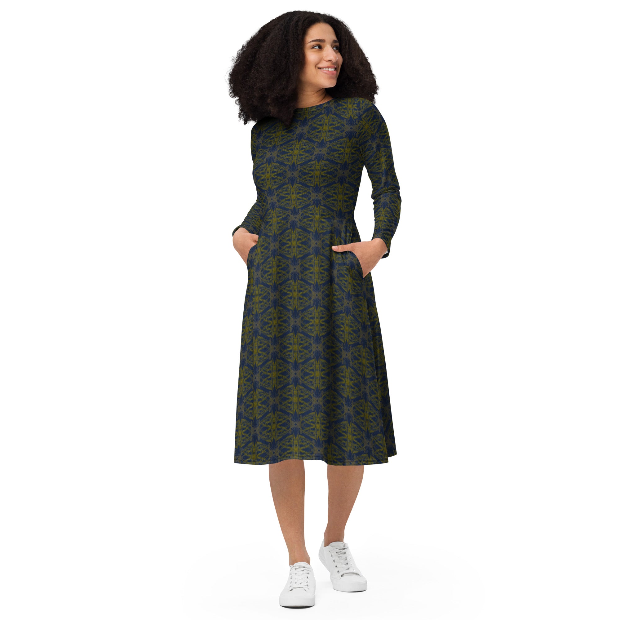 Model walking in the abstract print statement dress.