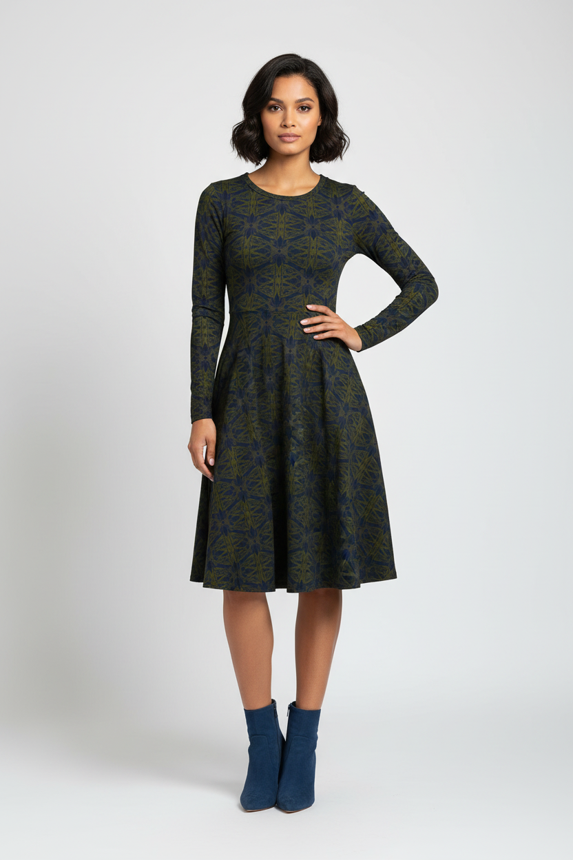 Woman wearing a patterned dress on a white background