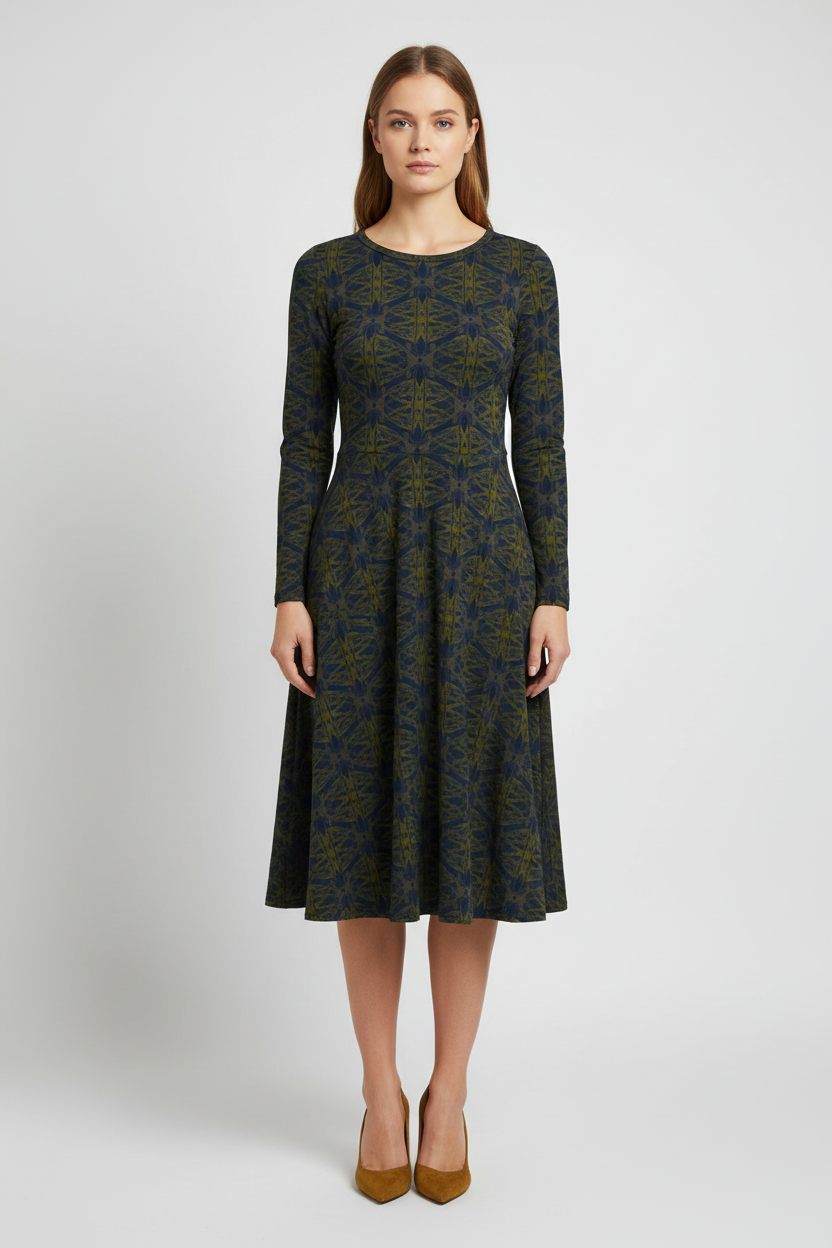 Woman wearing a patterned dress on a white background
