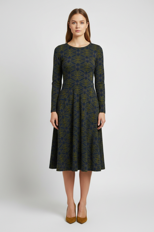 Woman wearing a patterned dress on a white background