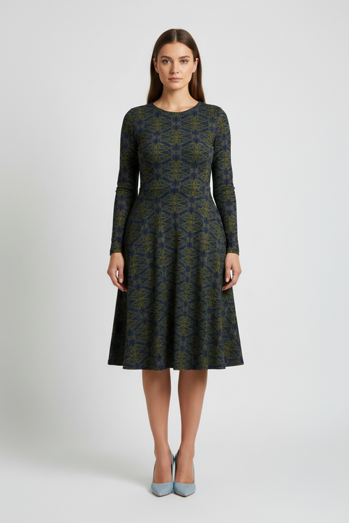 Woman wearing a patterned dress on a white background
