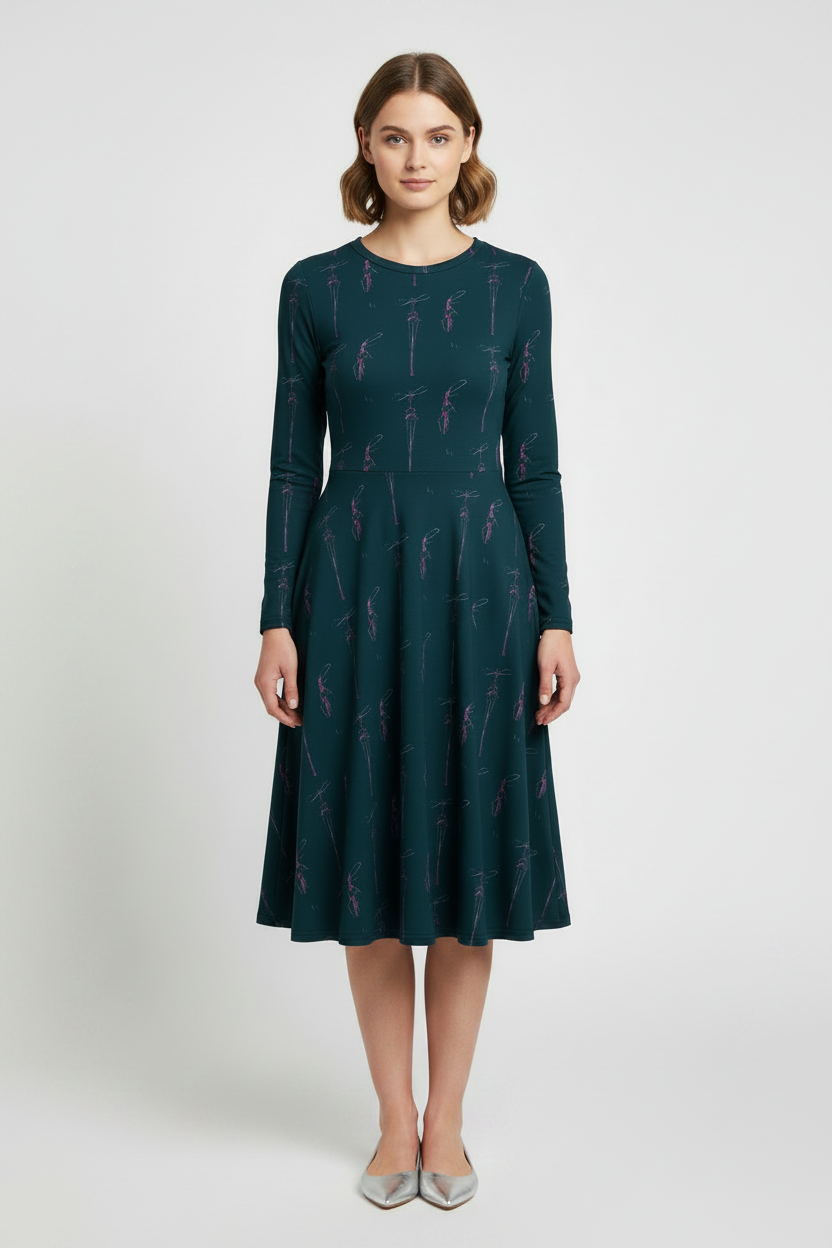 Woman wearing a dark green dress with a subtle pattern on a white background