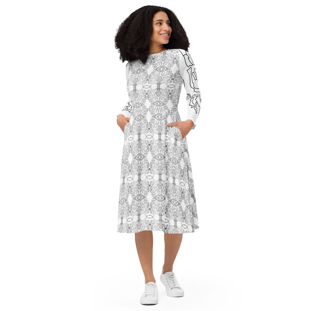 Woman wearing a white dress with black floral pattern on a white background