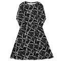 Fitted black and white long-sleeve midi dress from APPARELHUE showcasing a dynamic linear pattern.