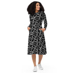 APPARELHUE wearable art fashion: black A-line midi dress with intricate white criss-cross graphic design.