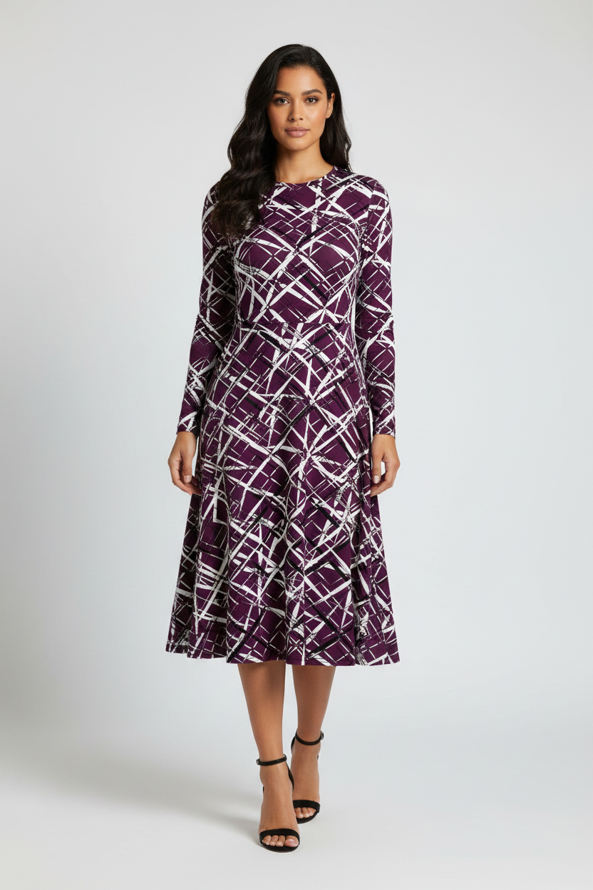 Woman wearing a purple patterned dress on a white background