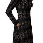 A long-sleeve black dress with an allover pink line-art print of cartoon characters, shown on a model against a white background.