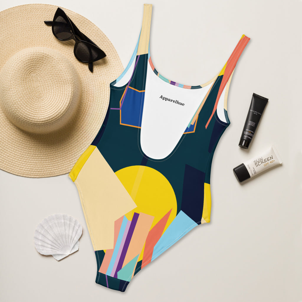Detailed view of the geometric shapes and colors on the one-piece swimsuit.