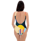 Fashion model posing in a stylish and eye-catching geometric print one-piece.