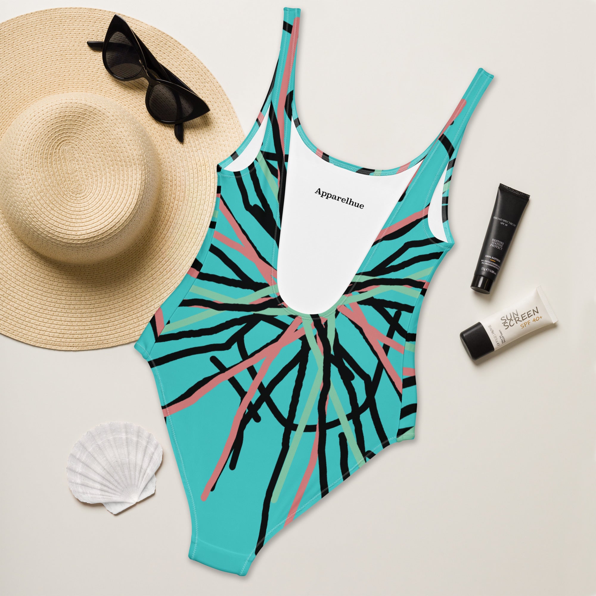 Detailed view of the intertwining lines and colors on the one-piece swimsuit.