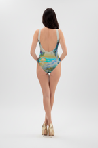Woman wearing a swimsuit with a scenic design on a white background