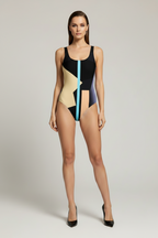 Woman wearing a colorful swimsuit on a plain background