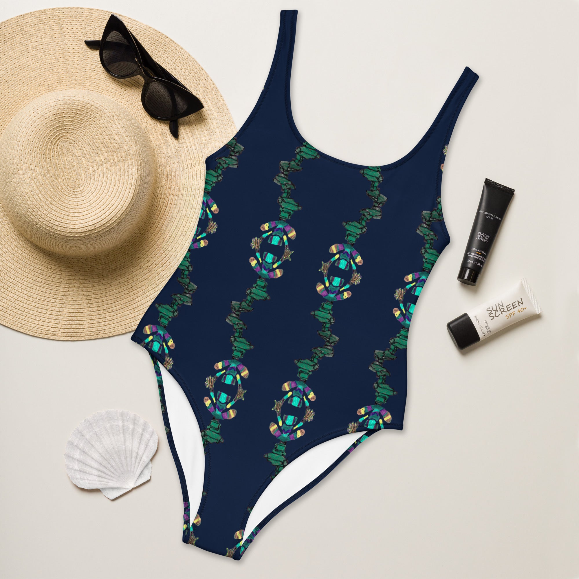 Blue artistic one-piece swimsuit with symmetrical emerald print
