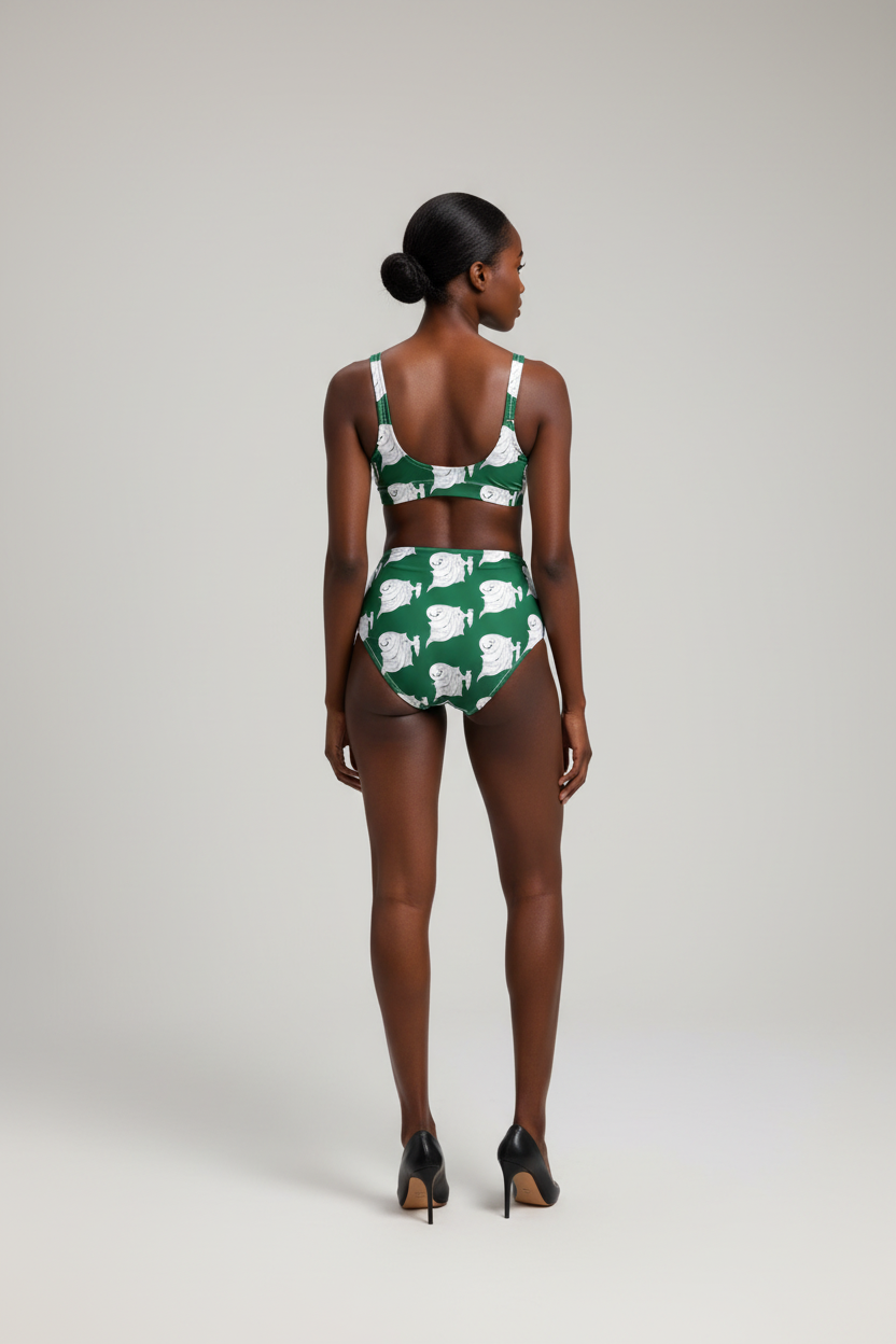 Woman wearing a green and white checkered swimsuit on a plain background