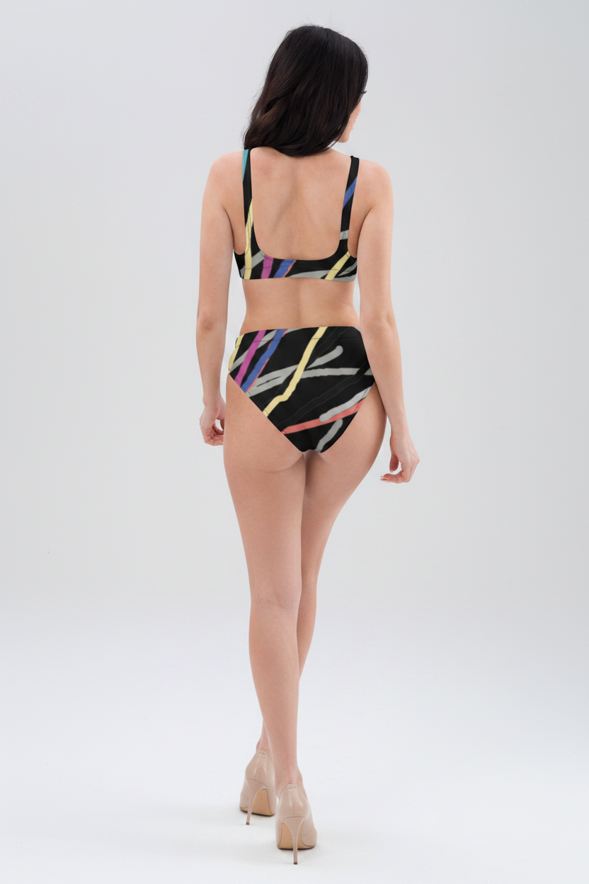 Woman wearing a colorful bikini set on a white background