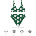 Detailed view of the fabric and playful ghost pattern on the two-piece swimsuit.