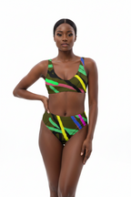 Model wearing a colorful bikini set on a white background