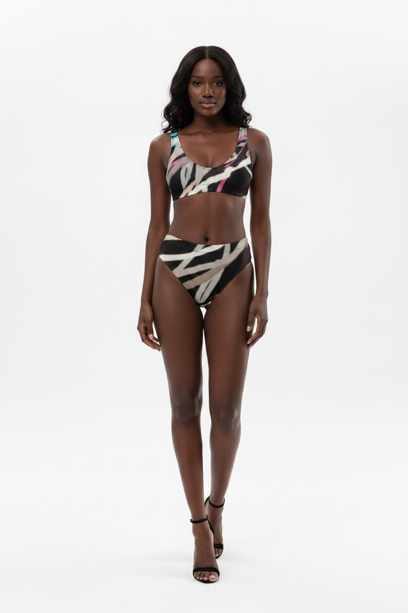 Woman wearing a colorful bikini set on a white background